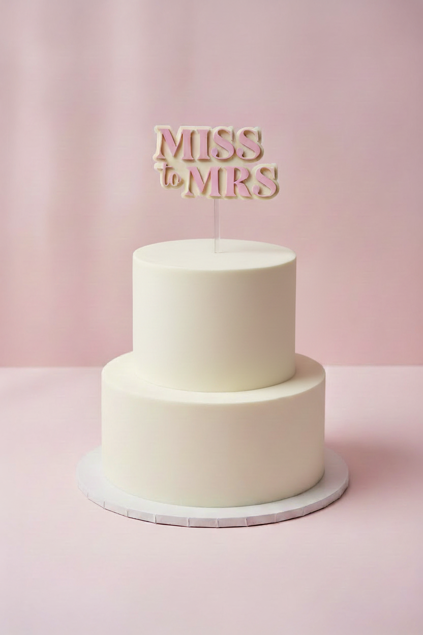 Minimal white bridal shower cake with Miss to MRS topper